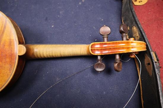 An early 20th century violin, bears label Paolo Fiorini, Taurini 1928, cased with a bow, single-piece back 36cm